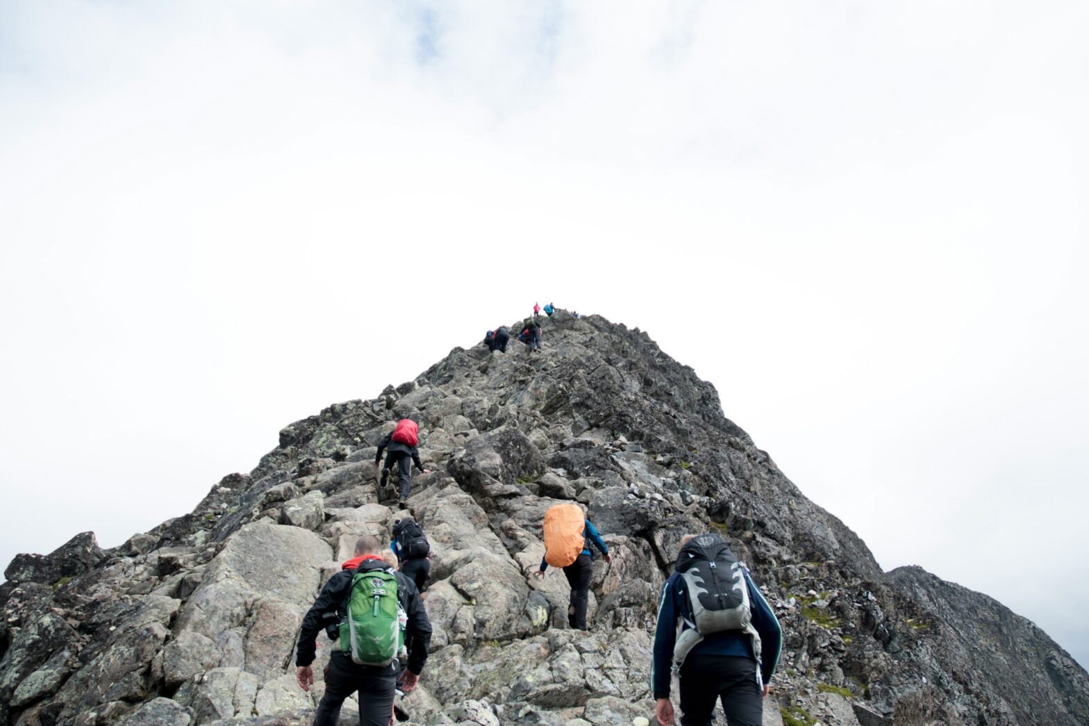 Photo of people climbing a mountain used to illustrate a Sherpa guiding new team members for time to rethink onboarding